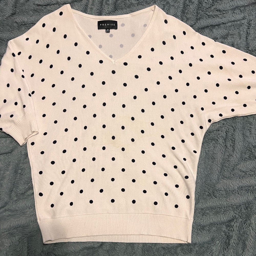 Oversized V-neck white top with black polka dots